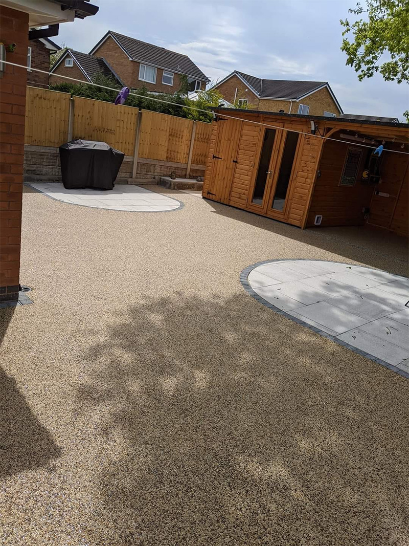 Resin bonded patio with paved sections